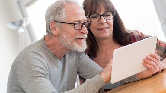 Older couple using a tablet together